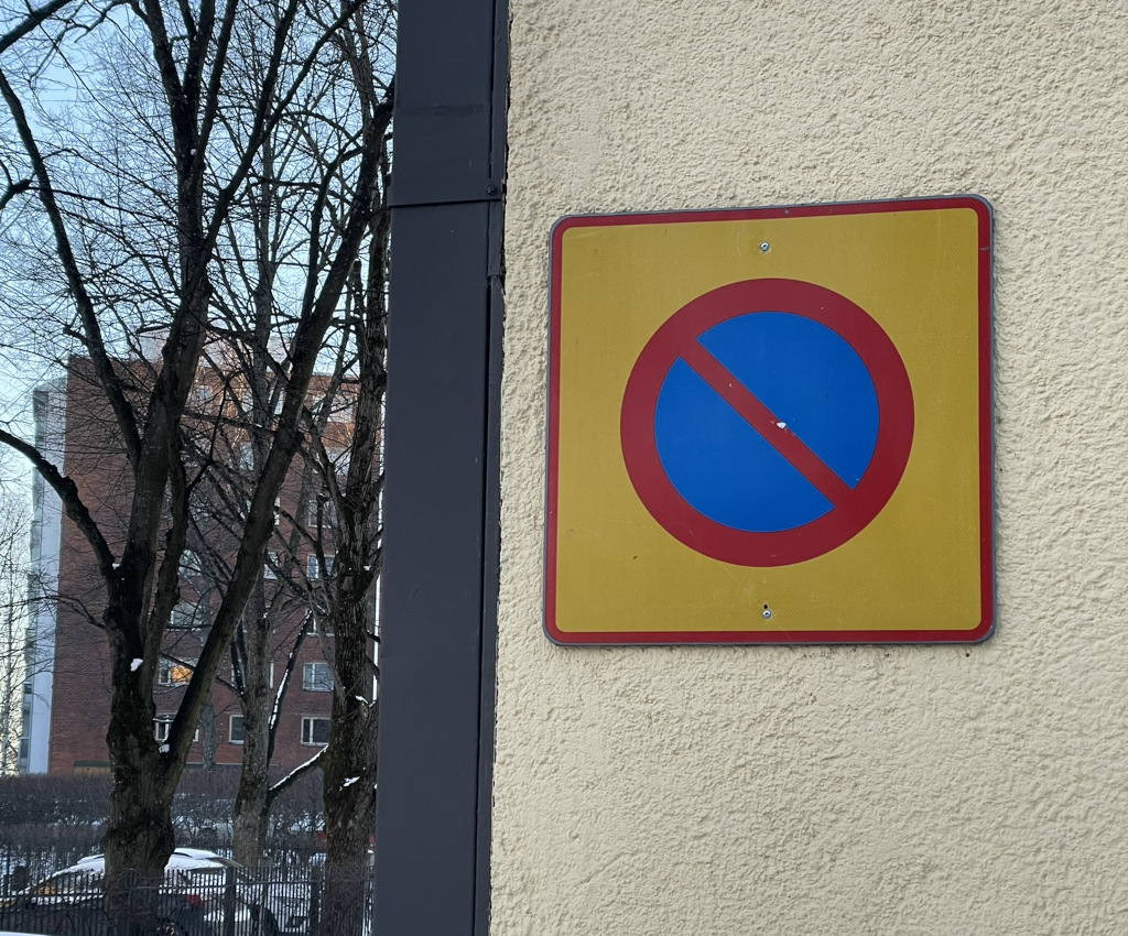 No parking zone sign on a street corner